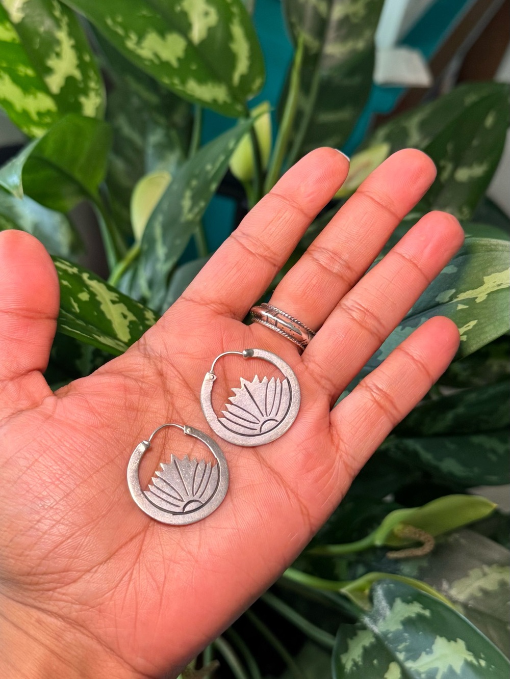 Vintage sterling silver lotus flower cutout hoop earrings.